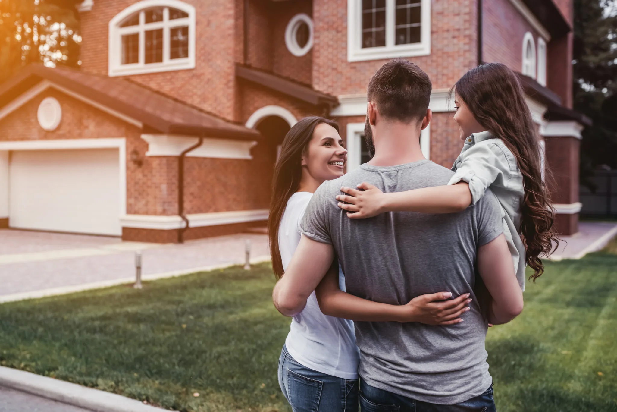 Family standing outside their home